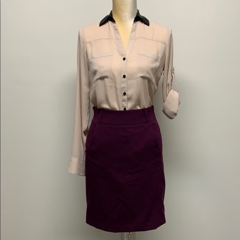 XS Express blouse with faux leather collar.